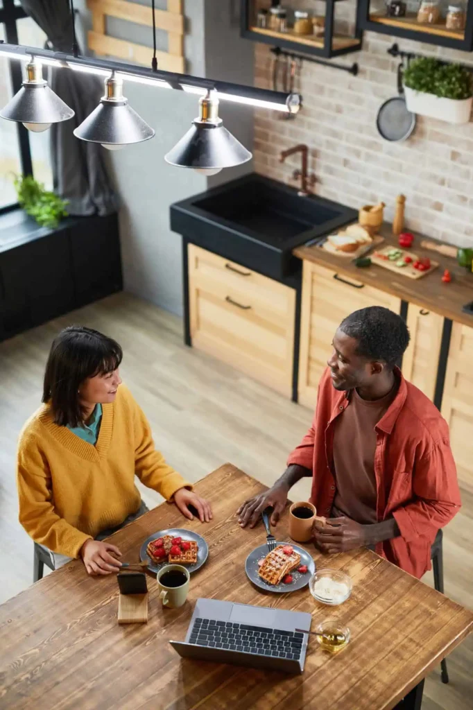 Two people at a kitchen table